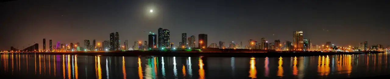 Sharjah skyline panorama at night